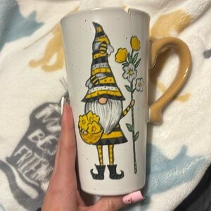Super cute ceramic gnome mug has a small chip on the top